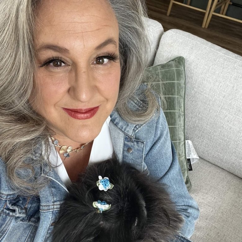 Top 5% Wisconsin realtor Anne Baranski holding her dog