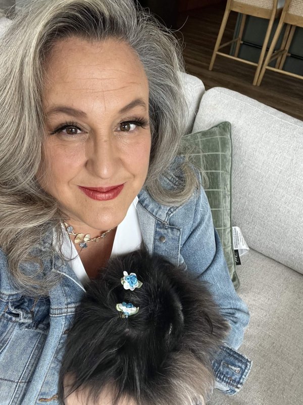 Top 5% Wisconsin realtor Anne Baranski holding her dog