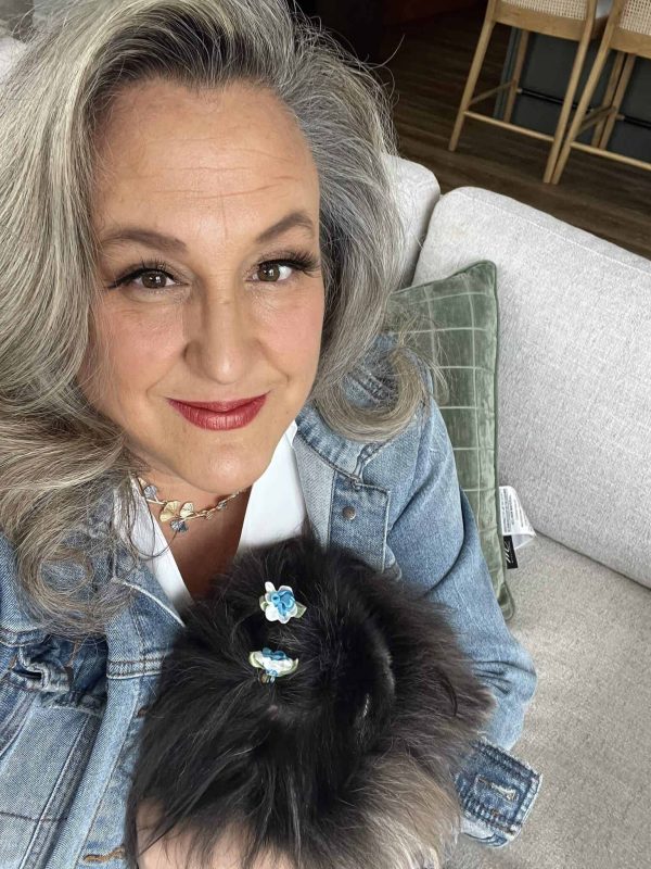 Top 5% Wisconsin realtor Anne Baranski holding her dog